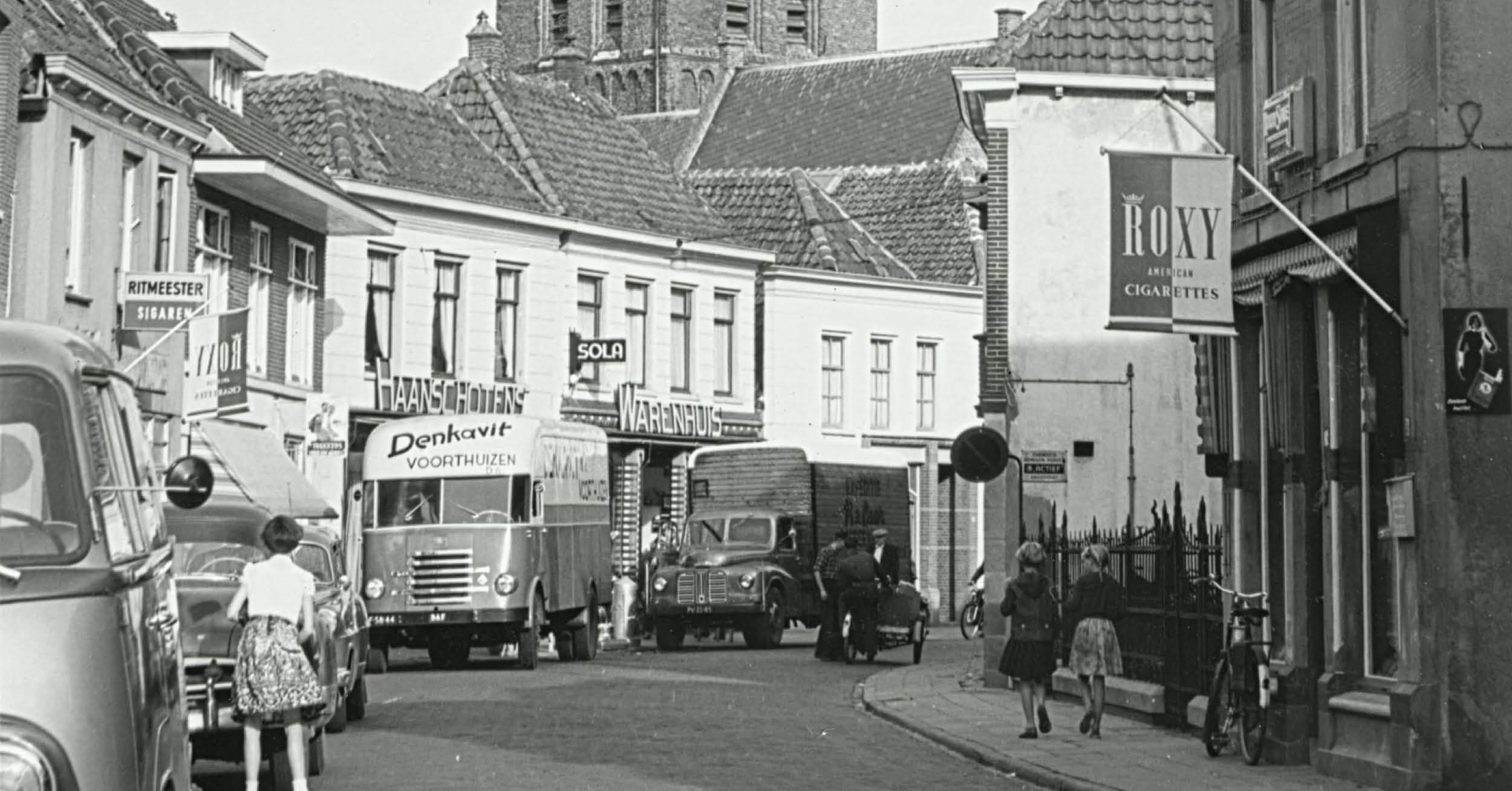 Historical trucks Denkavit in the street